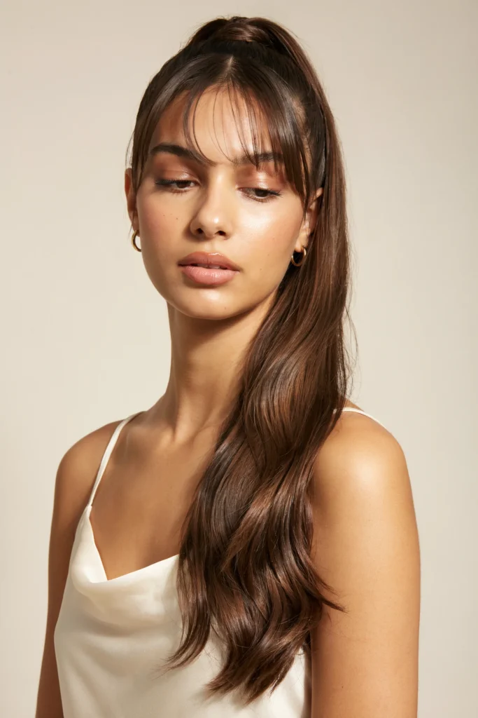 Ponytail with Curled Ends and Soft Bangs