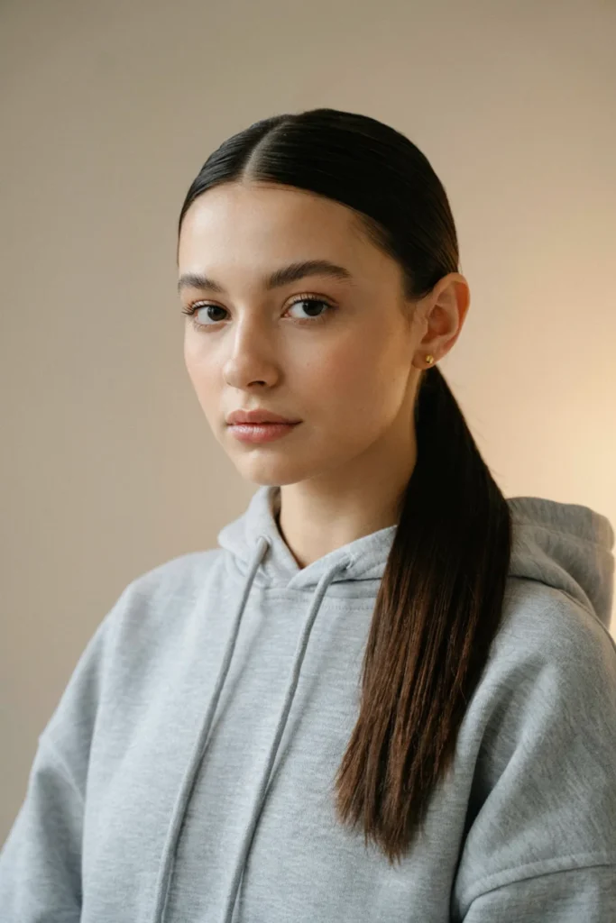 Sleek Low Ponytail with a Middle Part